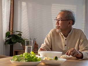 Man struggling to eat certain foods